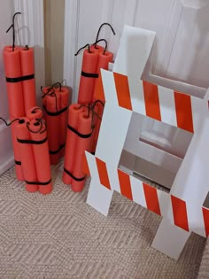 some orange and white construction cones are on the floor