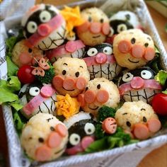 a tray filled with lots of different types of food on top of a wooden table