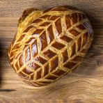 two pieces of bread sitting on top of a wooden table