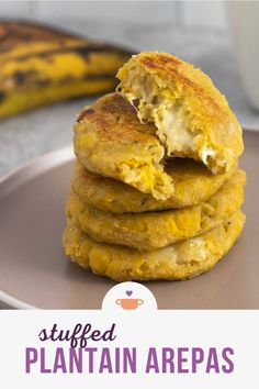 a stack of pancakes sitting on top of a plate with a banana in the background