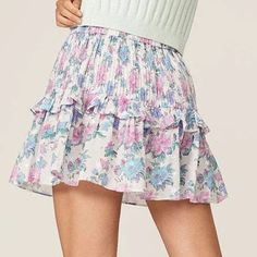 Ruffled in their dreamy Sea Orchid floral cotton, the label's Ignacia mini skirt is a mood-boosting favorite for summer. Elasticized waistband Pull-on style. Fabric: 100% cotton Hand wash Imported Floral Print Mini Skirt For Garden Party, Floral Mini Skirt For Garden Party, Spring Mini Skort, Mini Ruffled Skirt For Garden Party, Summer Garden Party Skirt With Ruffle Hem, Spring Skort With Elastic Waistband, Spring Voluminous Mini Skort, Spring Brunch Ruffled Skort, Feminine Floral Print Flared Mini Skirt