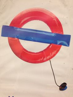 an inflatable tube attached to a red and blue ring