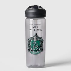 a harry potter water bottle with the sly crest on it's front and side