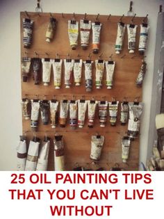 a wooden shelf with lots of paint tubes hanging from it's sides and the words 25 oil painting tips that you can't live without