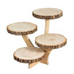 three pieces of wood stacked on top of each other in the shape of tree stumps