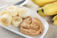 some bananas and peanut butter on a plate