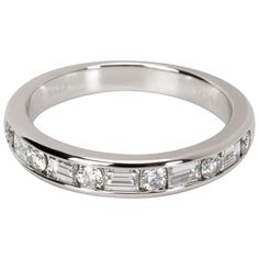 a white gold wedding band with baguettes and channeled diamonds on the side