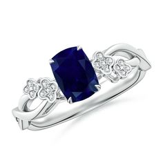 a white gold ring with a blue sapphire and diamonds