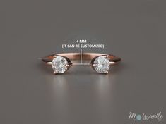 an image of a pair of engagement rings with measurements for the size and diamond on each side