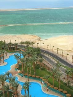 an aerial view of the beach and pool area