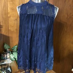 Lined From Bodice To Hem. Navy Lace Is Cut With Border Making A Natural Hem. Different Lace Trims Neck And Armholes. Pullover Dress Has Buttons At Back Neck. Never Worn. Nylon With Polyester Lining. Machine Wash. Chic Blue Lace Top, Blue Lace Sleeveless Tops, Sleeveless Blue Lace Tops, Casual Blue Top For Date Night, Navy Lace, Lace Tops, High Collar, Lace Trim, Bodice