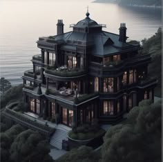 an aerial view of a large house by the water