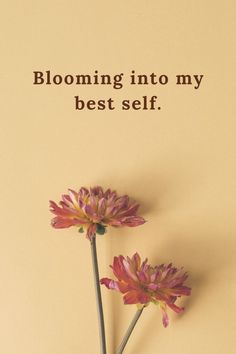 two pink flowers with the words blooming into my best self