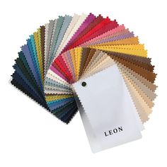 an assortment of color swatches with the name leon on one side and white tag in the middle