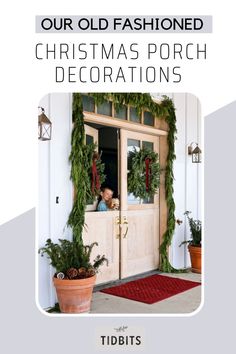 the front door is decorated with christmas wreaths and greenery