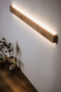 a wooden shelf with some plants on it