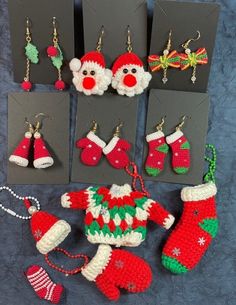 knitted christmas stocking, stockings and santa hats are displayed in front of greeting cards