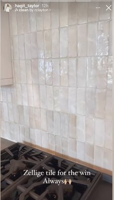 a white tile backsplash with the words zellige tile for the win alwayss