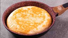 a pot filled with food sitting on top of a table