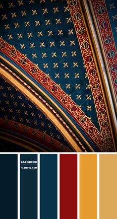 the ceiling is painted in blue and red with gold trimmings, along with other colors