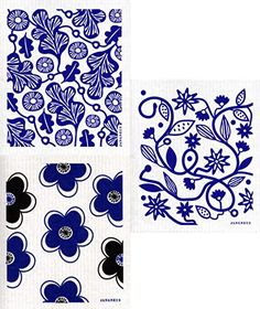 four blue and white paper napkins with flower designs on the front, one in black and