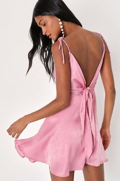 Raise a glass and toast to how good you look in the Party with Prosecco Pink Satin Tie-Back Mini Dress! Sleek woven satin shapes this party-perfect dress that has tying straps, a cowl neckline, and a sleeveless bodice that ties at the back. A high waist tops an A-line skirt with a mini hem. Hidden back zipper/clasp. Fit: This garment fits true to size. Length: Mid-thigh. Size medium measures 30" from adjustable straps to hem. Bust: Great for any cup size. Waist: Fitted - very fitted at natural w Pink Hoco Dress, Rehearsal Dinner Attire, Pretty Formal Dresses, Dinner Attire, Mini Dress Satin, Dress Tape, Casual Wedding Guest Dresses, Hoco Inspo, Fall Ball