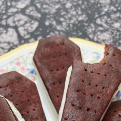 three pieces of chocolate cake on a plate