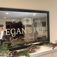 a man standing in front of a glass window with the words vegan's pub on it