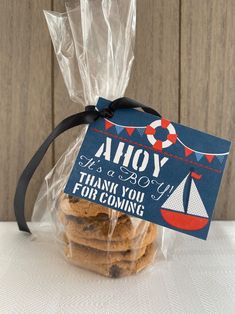 there is a bag of cookies in the shape of a sailboat and it says ahoy thank you for coming