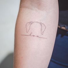 a small elephant tattoo on the arm