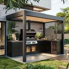 an outdoor kitchen is shown in the backyard