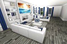 a living room filled with white furniture and blue accents