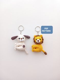 two crocheted keychains with animals on them, one in the shape of a lion and the other as a dog