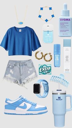 the contents of a woman's blue outfit including sneakers, water bottle and other items