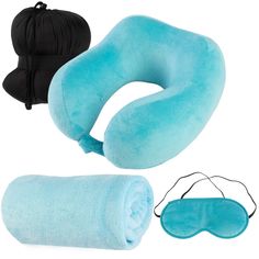 the travel pillow and eye mask are set up to look like they're in bed