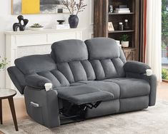 a living room with a gray reclining couch