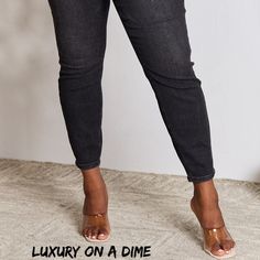 High-Rise Waist Black Denim Judy Blue Classic Skinny Jean Pants When it comes to jeans these have it all and more!High waist offers style, comfort and functionality while creating an elongated silhouette that enhances your curves while preventing muffin top.Slightly stretchy so you get that perfect fit every time.Skinny fit gives a sleek trendy look that works perfectly with heels or boots.Equipped with functional pockets, the belt loops offer the option to accessorize for a personalized touch.W Trendy Non-stretch Tapered Leg Jeans, Trendy Non-stretch Tapered Jeans, Black Cropped Denim Jeans, Black Tapered Leg Cropped Jeans, Black Stretch Jeans With Tapered Leg, Black Tapered Leg Jeans For Spring, Fitted Black Cropped Denim Jeans, Mid-rise Black Denim Jeggings, Black Stretch Denim Jeggings