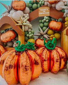 there are many balloons in the shape of pumpkins