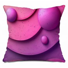 a pillow with pink and purple shapes on it's side, in front of a white background