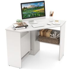 a white computer desk with a monitor and keyboard