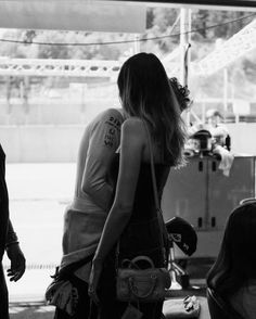 black and white photograph of two women talking to each other