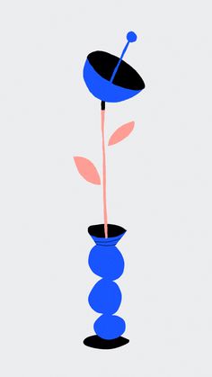 a blue vase with a flower in it