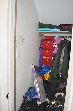 the closet is full of clothes and other things to be packed into it for storage