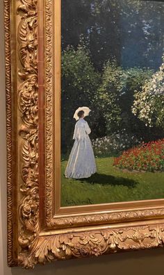 an oil painting of a woman in a white dress and hat walking through a garden