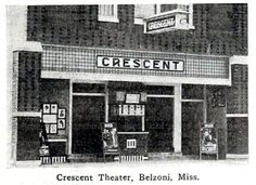 an old black and white photo of the crescent theater, belonii, miss