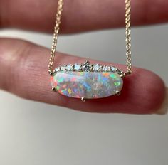 14K Yellow gold necklace with Australian Opal and Diamonds Metal: 14K yellow gold Opal size: 16.5x6mm (1.5 ct) Diamonds: 1-2.2mm VS (0.17ct tw) Chain: 1mm cable Length: 16.5″ Natural untreated stones. Not man made. Not lab created. Australian Opal Necklace, Gold Opal Necklace, Opal Necklace Gold, Australian Opal Jewelry, Black Gold Jewelry, Necklace Opal, 14k Yellow Gold Necklace, Opal Pendant Necklace, Yellow Gold Necklace