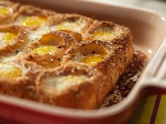 an egg dish in a red casserole dish with a fork on the side