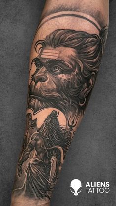 a man with a lion tattoo on his arm