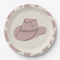 a paper plate with a pink cowboy hat on the front and polka dots around it