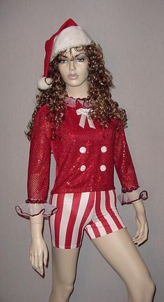 a female mannequin wearing a red and white outfit with santa's hat